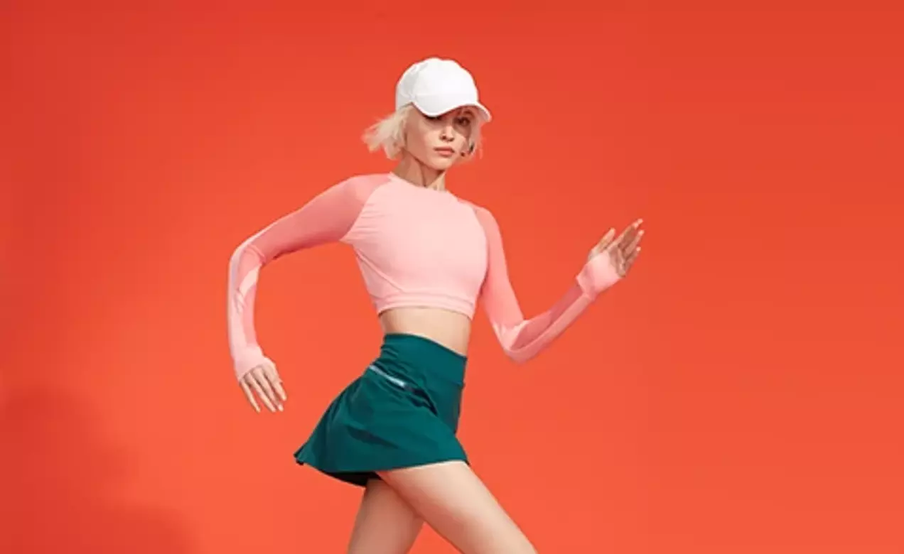 A woman wears sports compression socks made with LYCRA COMPRESSION technology to energize tired legs.